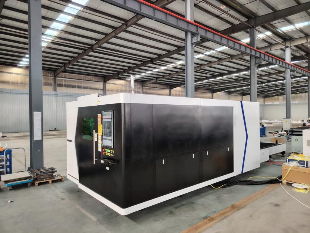 Enclosed laser cutting machine with a dark protective housing and viewing windows